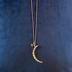 Melinda Maria gold necklace with crescent moon pendant and star accent charm
